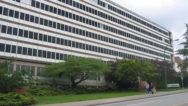 A tower of Lions Gate Hospital and its street sign in North Vancouver, British Columbia